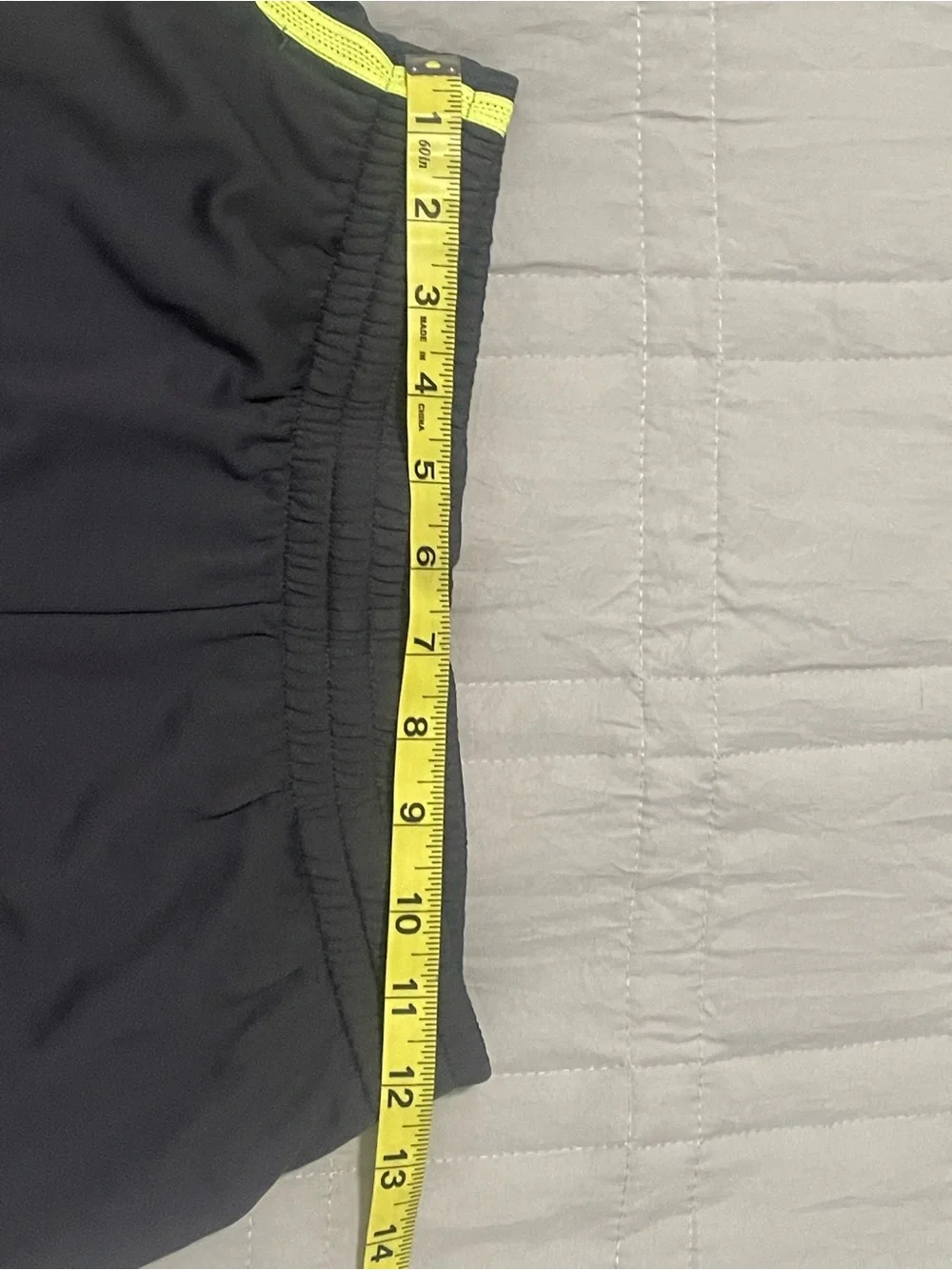 Nike Kids Black Athletic Shorts with Neon Yellow Swoosh